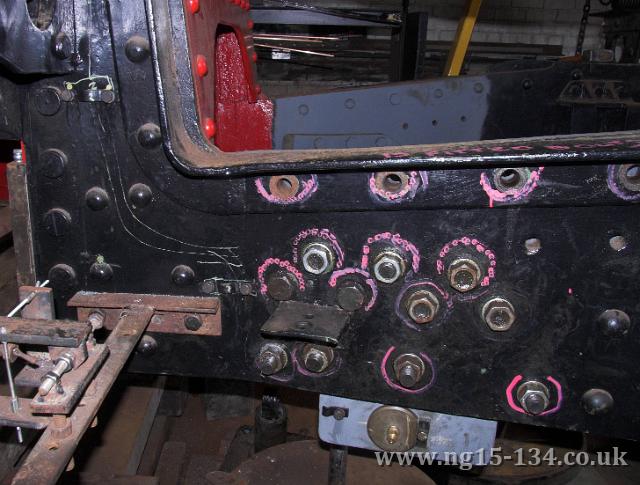 Bolts holding the rear frame stretcher in place marked out ready to be replaced by fitted bolts. (Photo: L. Armstrong)