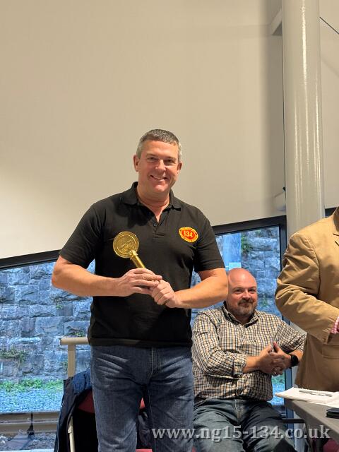 Project leader Adrian Strachan receiving the Token of Appreciation award. (Photo: Robert Purcell)